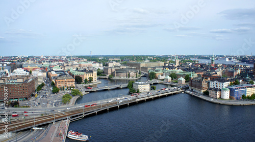 Aerial view of roads with car traffic and beautiful cityscape from the observation deck of Town Hall, way to Gamla Stan, Stockholm, Sweden © Lunnaya