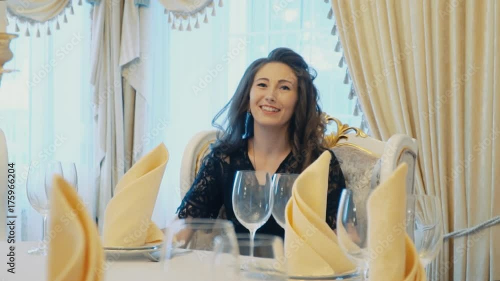 the girl is sitting at the table the girl is sitting at the table