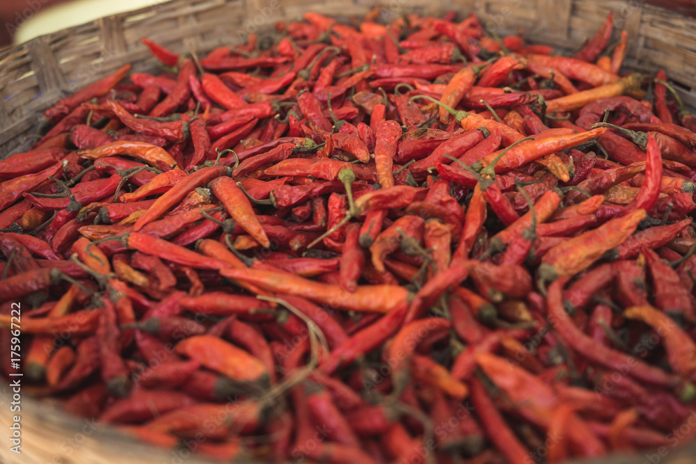 Fototapeta premium Organic dried chili peppers in a wooden basket.