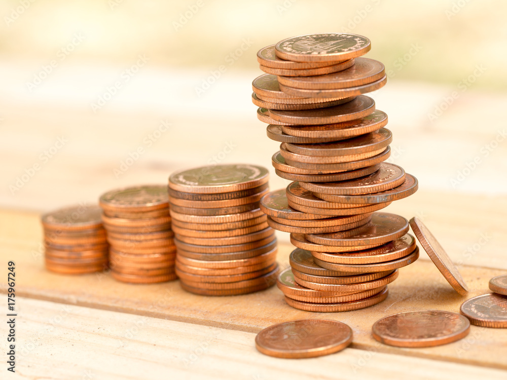 Four rows rising growth golden stack coins with unstable stack different position at last row showing high growth high risk and unstable in business. Growing and saving money concept. Four rows rising growth golden stack coins with unstable stack different position at last row showing high growth high risk and unstable in business. Growing and saving money concept.