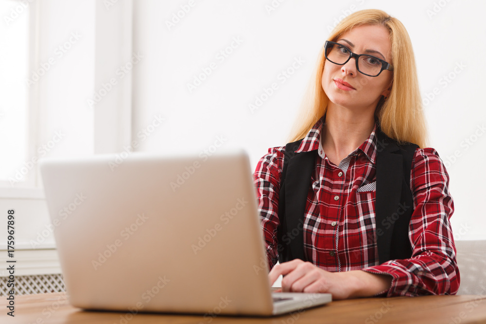 Business woman working on laptop at office Business woman working on laptop at office