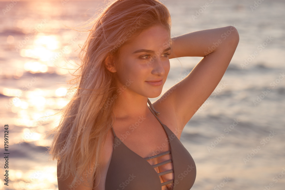 Happy carefree woman on the beach enjoying summer Happy carefree woman on the beach enjoying summer