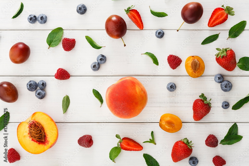 Assorted berries on white wooden table top view Assorted berries on white wooden table top view