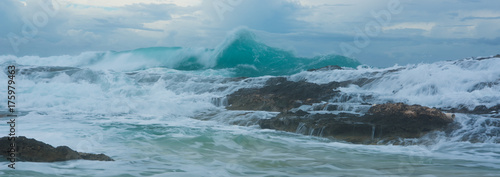 Big ocean wave breaking the shore