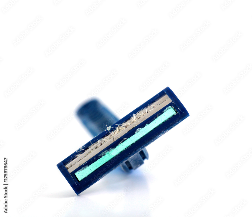 used shaving razor on a white brown background used shaving razor on a white brown background