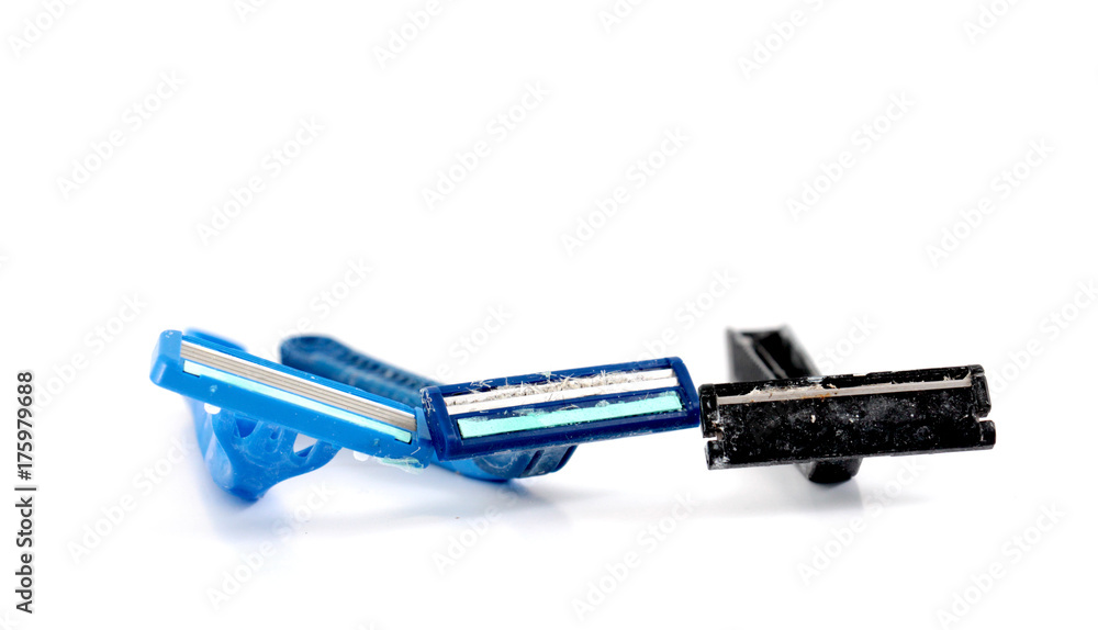 used shaving razor on a white brown background used shaving razor on a white brown background
