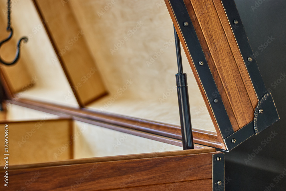 Solid teak chest. Wooden storage chest with lift gas spring. Open top chest Stock Photo Adobe