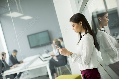 Modern business woman using...