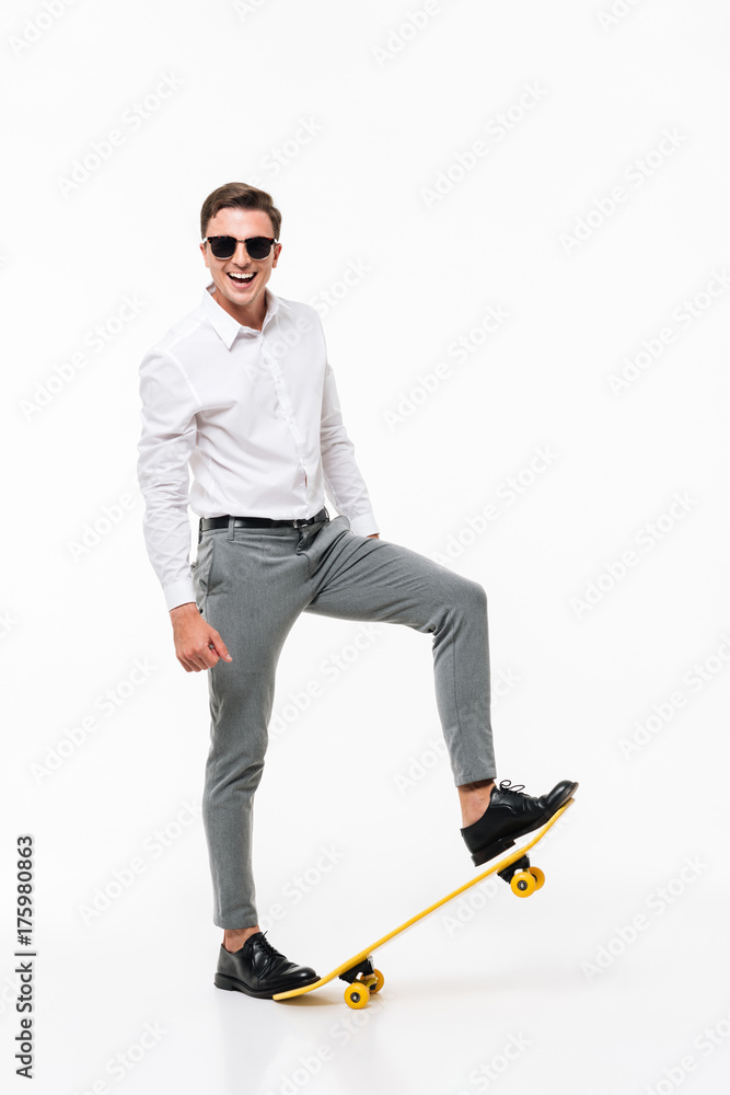 Full length portrait of a smiling man in white shirt Full length portrait of a smiling man in white shirt
