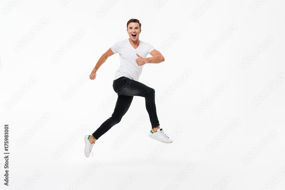 Full length portrait of a happy young casual man