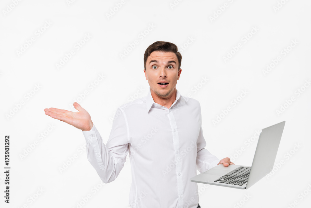 Portrait of a confused frustrated man in white shirt Portrait of a confused frustrated man in white shirt