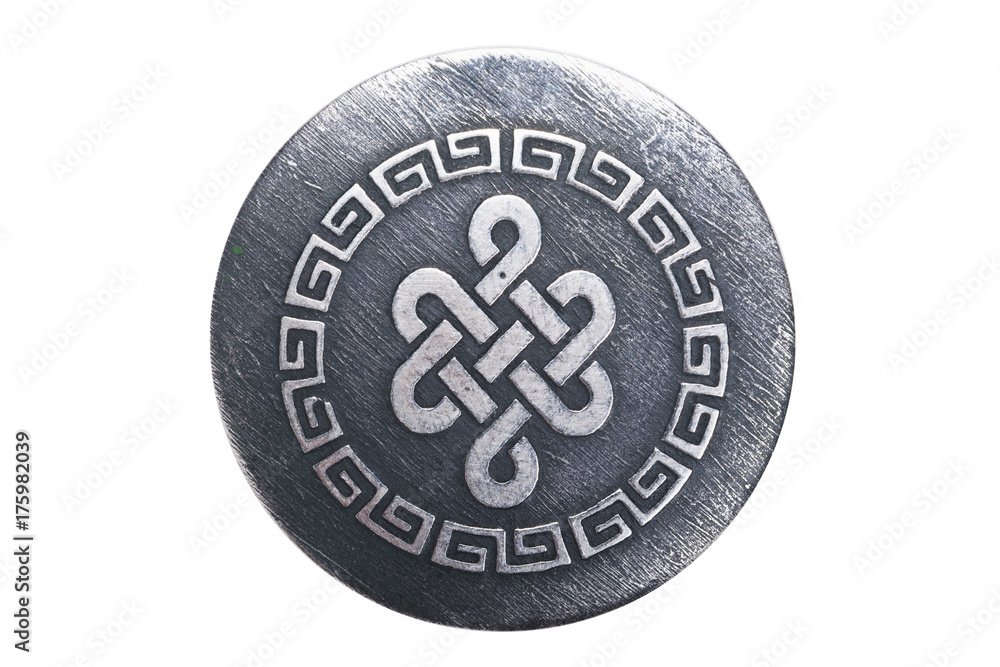 intricate ornament on a metal pendant intricate ornament on a metal pendant