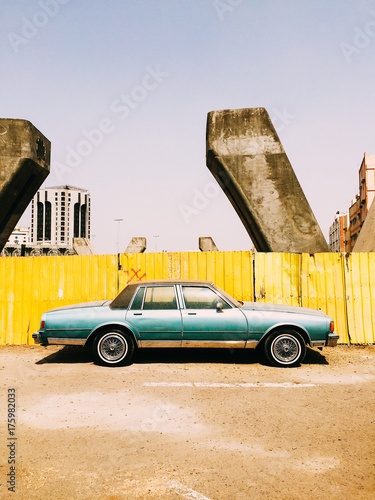 An old antique car parked photo