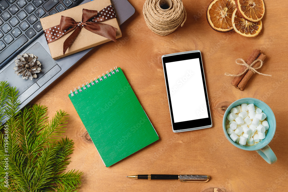laptop and phone with empty screen for christmas seasonal advertising laptop and phone with empty screen for christmas seasonal advertising