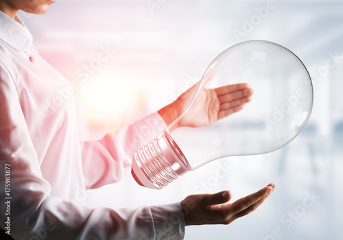 Good idea concept by means of lightbulb in hands.