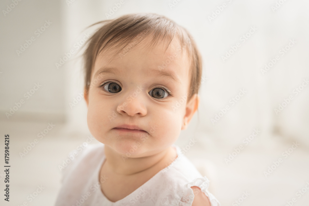 A Baby Girl Looking At The Camera A Baby Girl Looking At The Camera