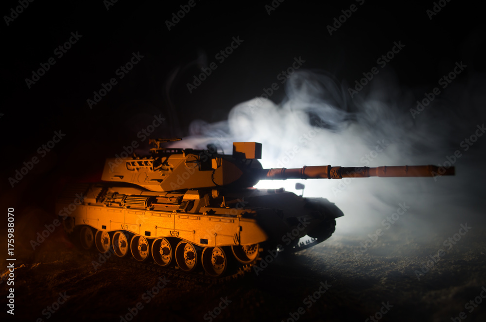 War Concept. Military silhouettes fighting scene on war fog sky background, German tank in action Below Cloudy Skyline At night. Attack scene. Armored vehicles