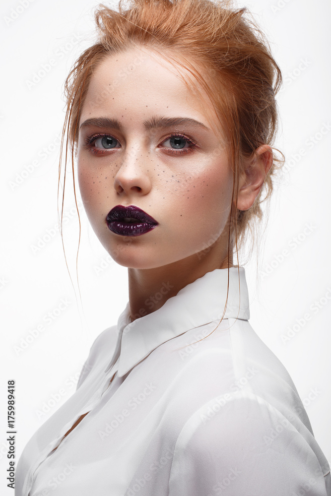 Young girl with a haircut in a white shirt. Beautiful model with nude make-up and Young girl with a haircut in a white shirt. Beautiful model with nude make-up and