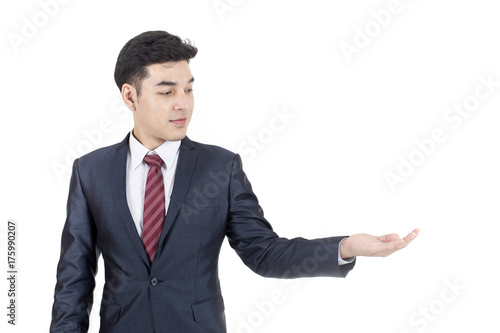 Asian Businessman Point to present for Business Plan, Man stand and smile, isolated on white background, Business vision concept.