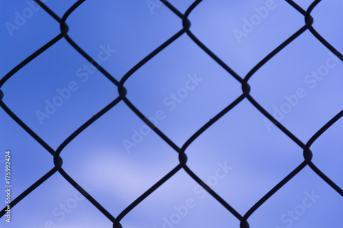 Fence texture. Clear blue sky in the background of mesh.
