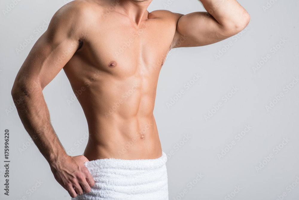 Naklejka premium Man is showing muscular sexual body
