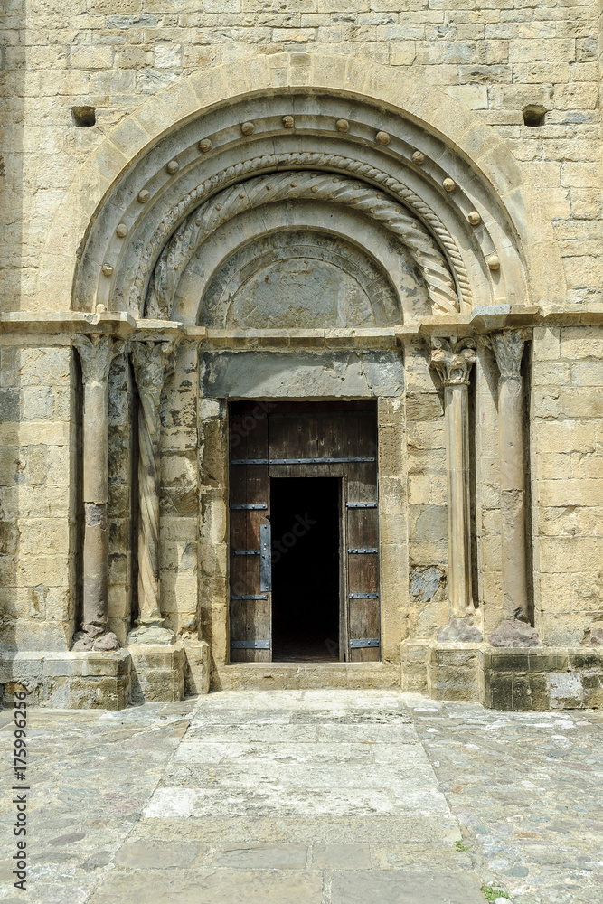 door and Romanesque arches of the church of St Kitts in the Beget town in Gerona, Spain.