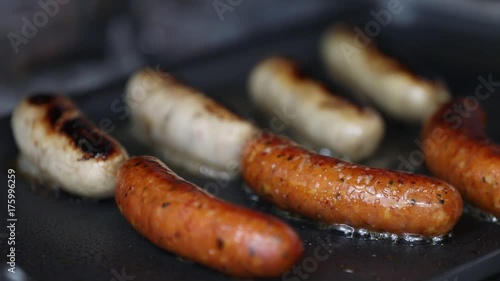 Close up of sausage frying  