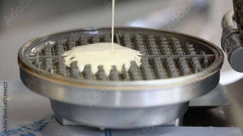 waffle mix pouring into vintage metal waffle maker