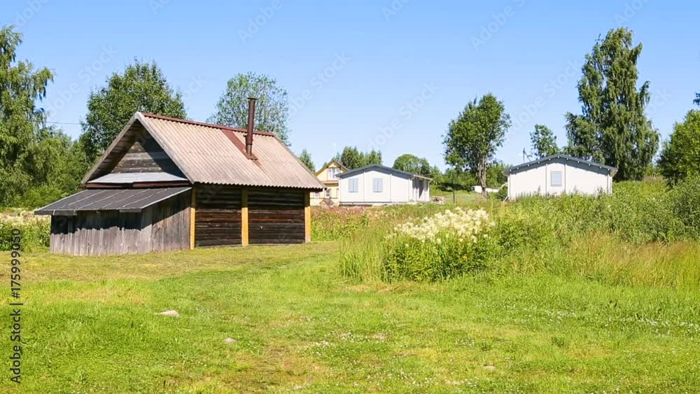 Traditional russian wooden bath at the countryside in summer sunny day Traditional russian wooden bath at the countryside in summer sunny day