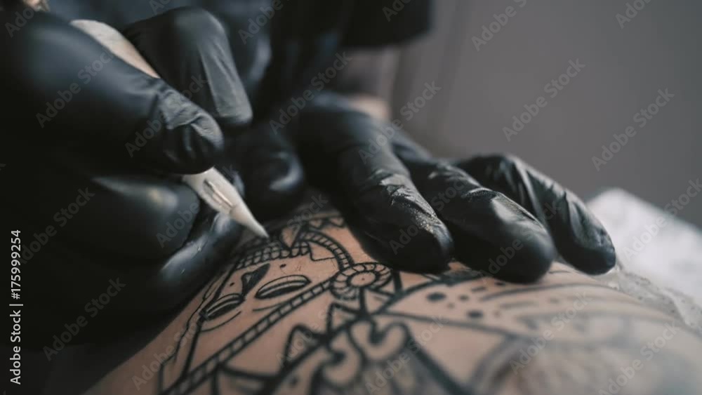 custom made wallpaper toronto digitalMacro view on professional tattoo master is painting tattoo with black ink, making cover. Works in black latex gloves with handmade rotor gun machine in his studio