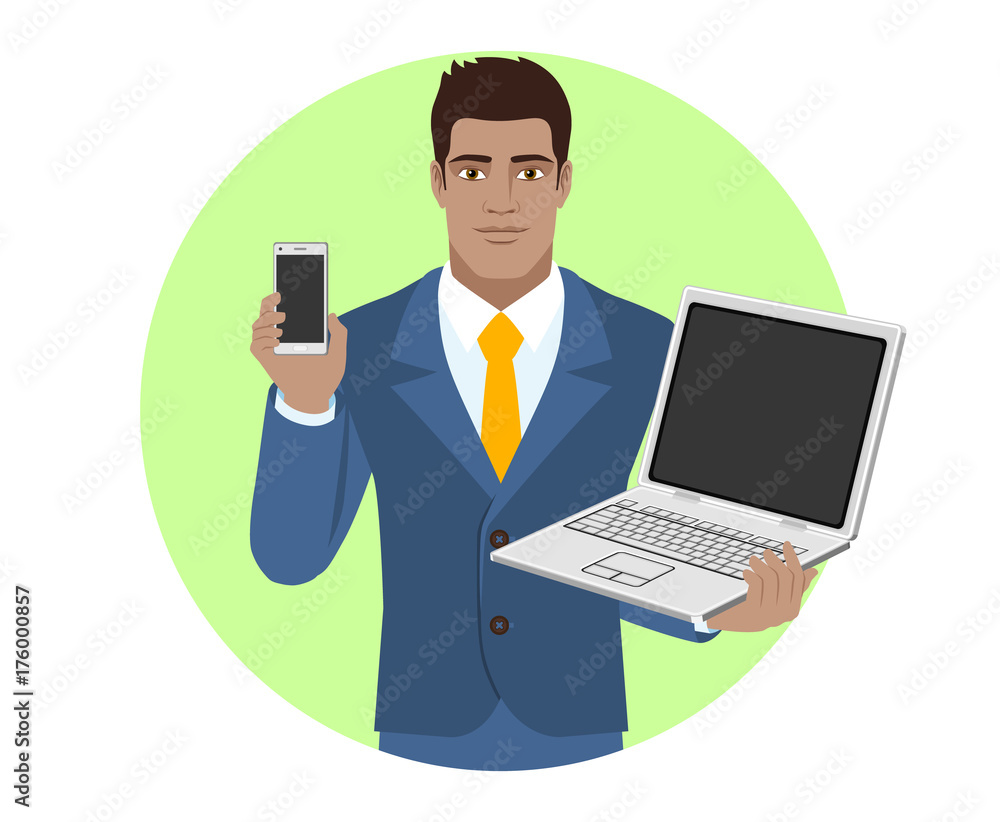 Businessman holding mobile phone and laptop notebook Businessman holding mobile phone and laptop notebook