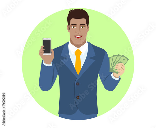 Businessman holding mobile phone and showing a money