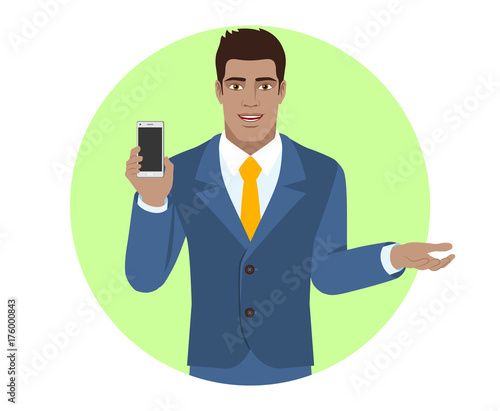 Businessman holding mobile phone and  gesturing