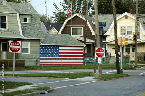 flag on house with do not enter signs