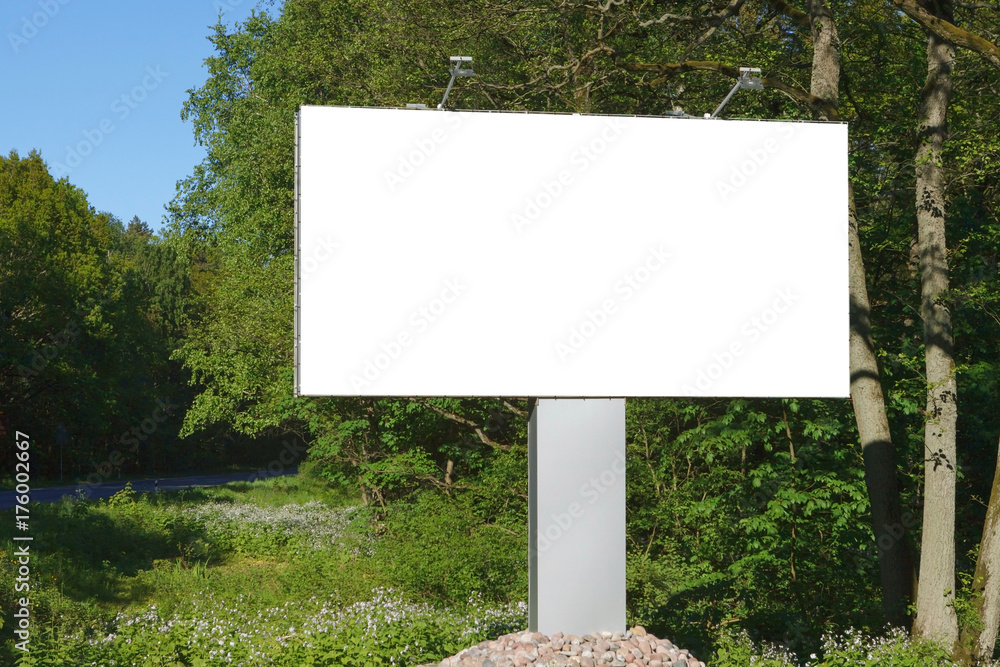 horizontal blank billboard on the background of green trees, mock up