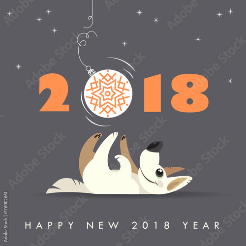 Cute dog plays with Christmas ball. Happy 2018 new year. Holidays greeting card.