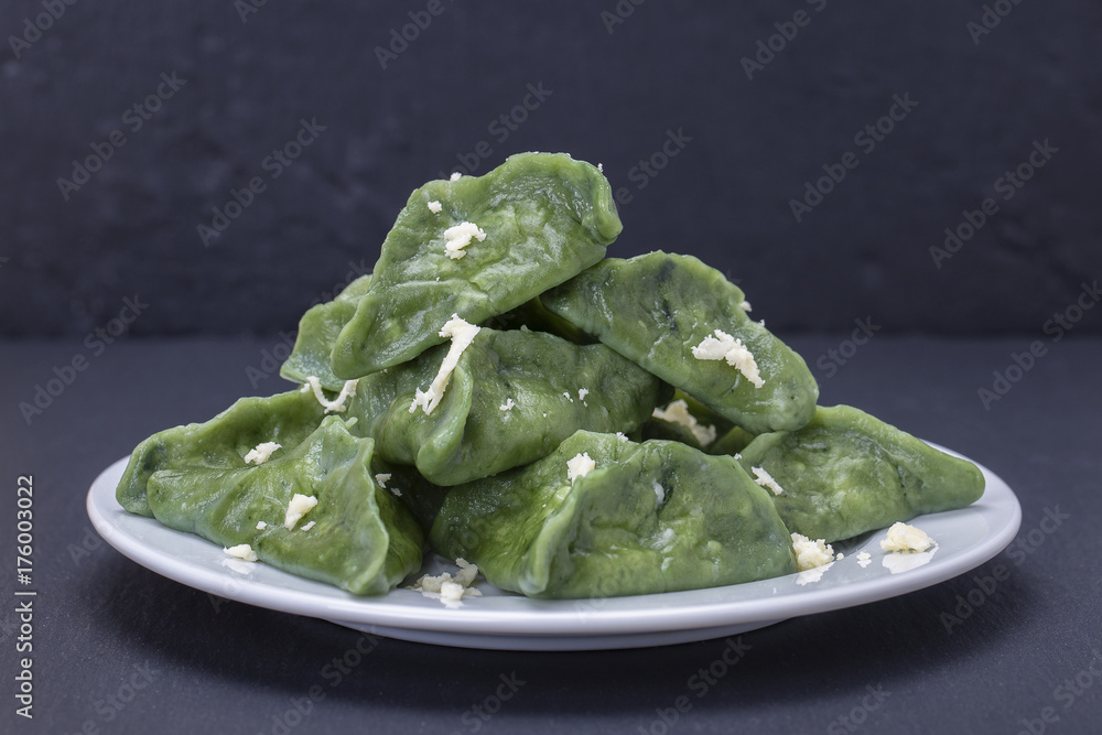 Green dim sum, chinese food. Dumplings with beef meat or mashed potatoes or cottage cheese in the dough with spirulina Green dim sum, chinese food. Dumplings with beef meat or mashed potatoes or cottage cheese in the dough with spirulina
