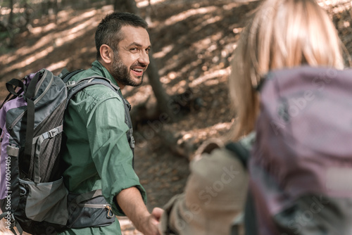 Cheerful loving couple hiking in forest © Yakobchuk Olena