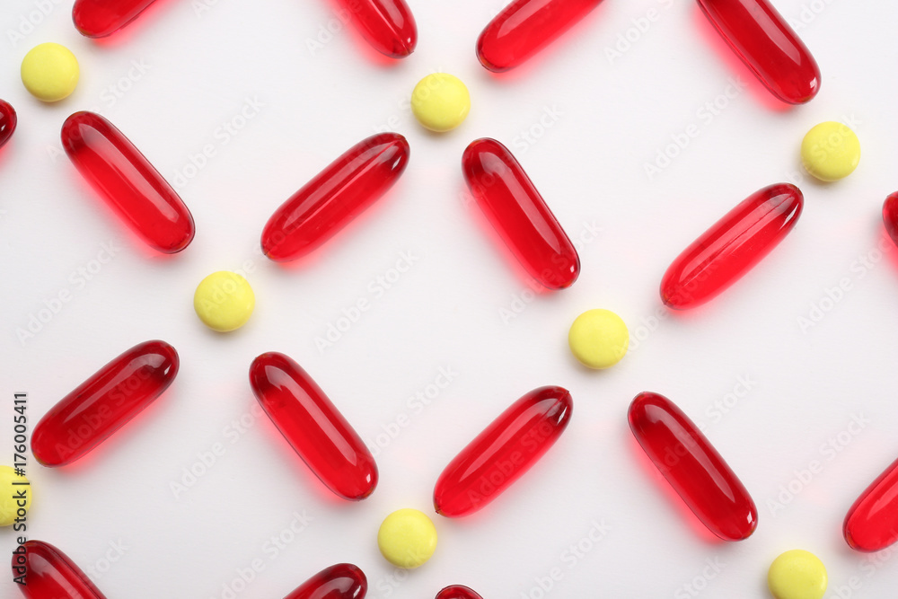 Composition with colorful pills on white background Composition with colorful pills on white background