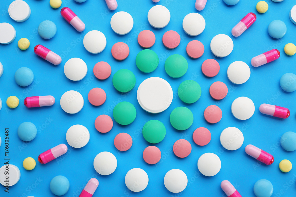 Composition with different pills on color background Composition with different pills on color background