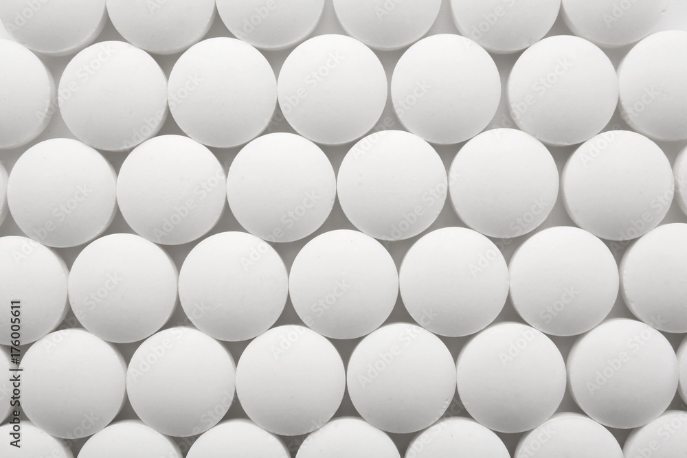 White round pills, closeup White round pills, closeup