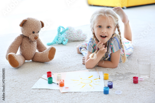 Cute little girl painting p...