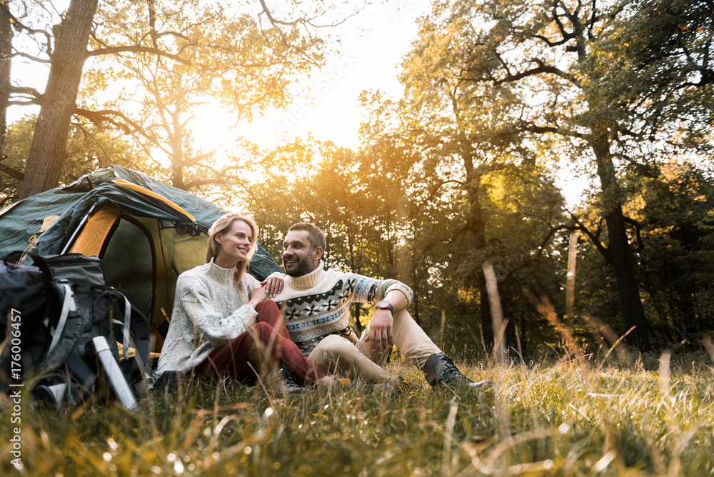 Joyful man and woman resting in nature together Joyful man and woman resting in nature together