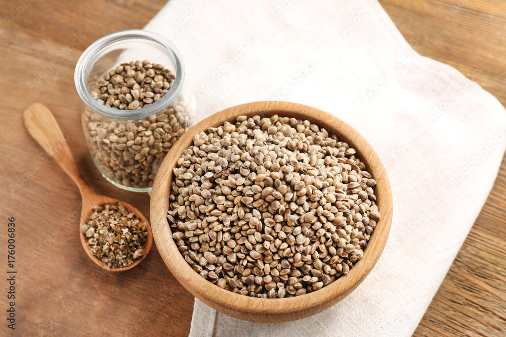 Composition with hemp seeds on wooden background Composition with hemp seeds on wooden background