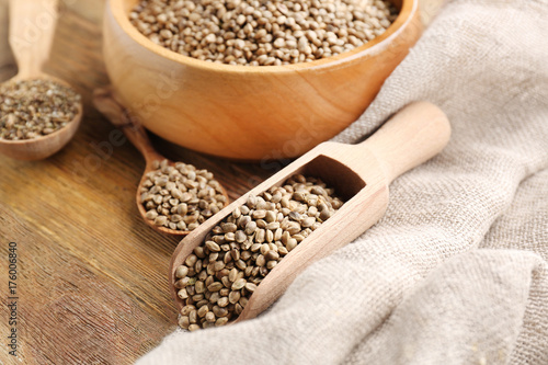 Composition with hemp seeds on wooden background
