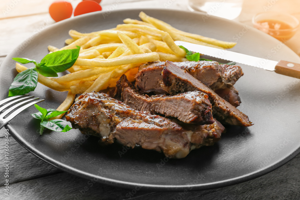 Plate with delicious grilled steak frites wooden table Plate with delicious grilled steak frites wooden table