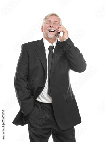 Elderly man talking by mobile phone on white background