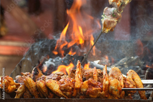 Fried chicken wings on fire, grill, barbecue, picnic preparation