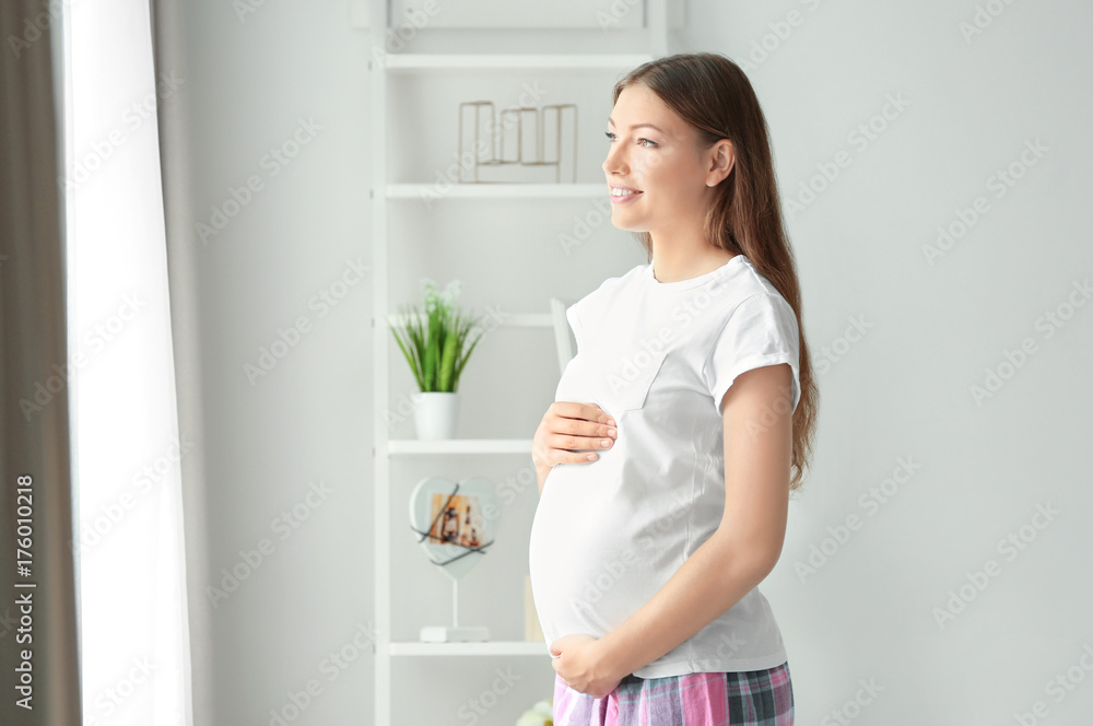 Morning of young pregnant woman in room Morning of young pregnant woman in room