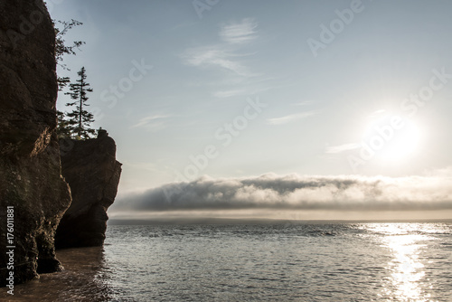 Sunrise famous Hopewell Rocks geologigal formations at low tide biggest tidal wave Fundy Bay New Brunswick Canada